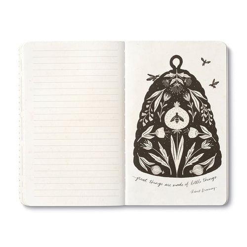 Open journal with lined pages beside a cream page of a large beehive filled with flowers and a bee, lettered: great things are made of little things