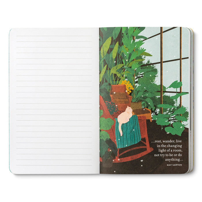 Open journal with lined pages beside a page of a person reading in a chair by a window framed with green plants