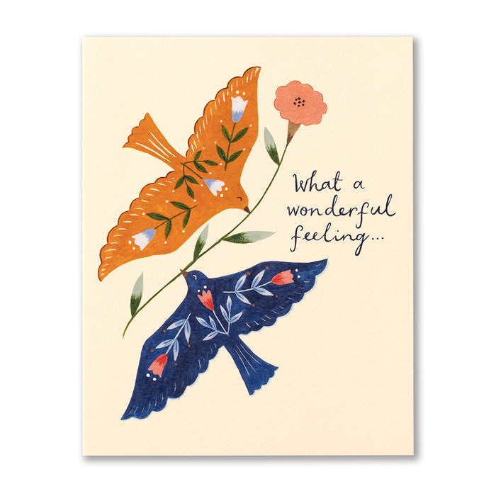 What a Wonderful Feeling friendship card with two folk-art birds in orange and navy holding a flower