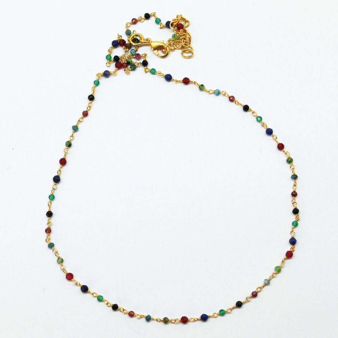 Fine gold bracelet with multi-coloured gemstone beads on a delicate chain