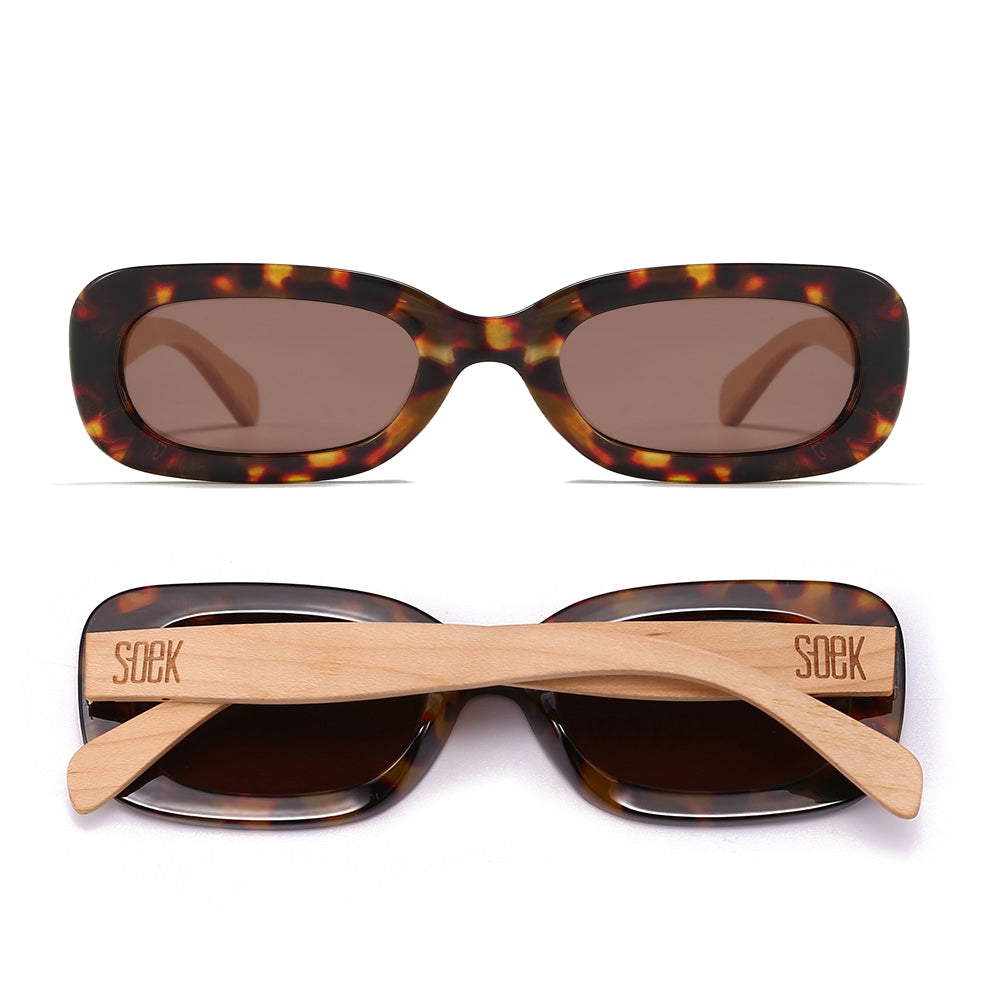 Two pairs of Vibe sunglasses in toffee tortoise, one front-on and one folded, showing the pale maple arms