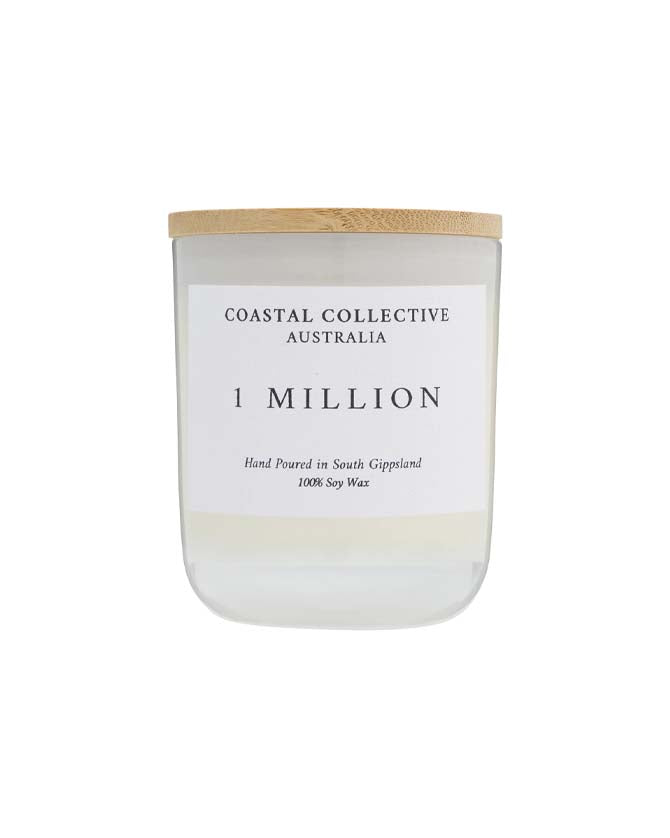 1 Million candle in a frosted glass jar with a pale wooden lid.