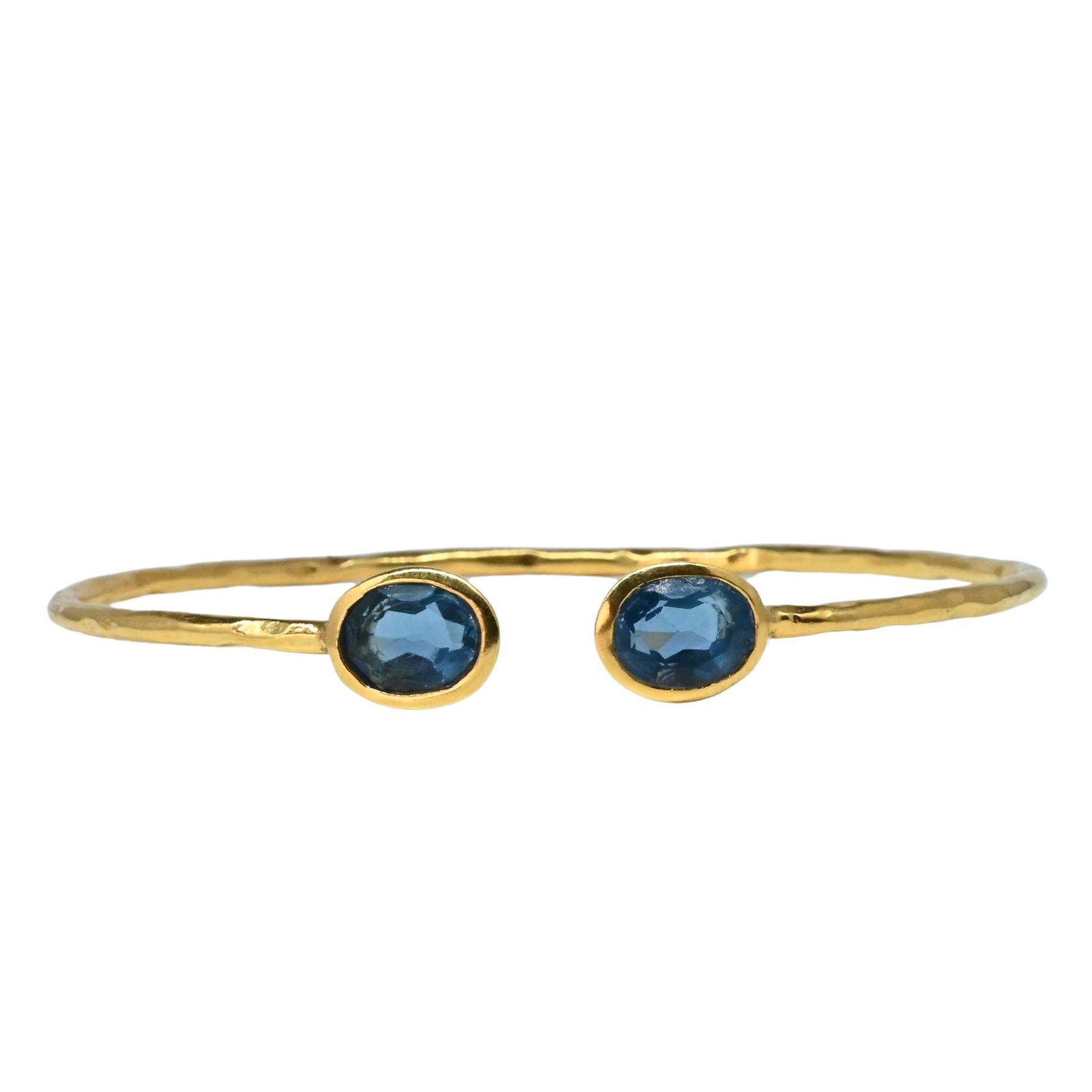 Fine Euro Gold cuff bangle with two London-blue oval gems