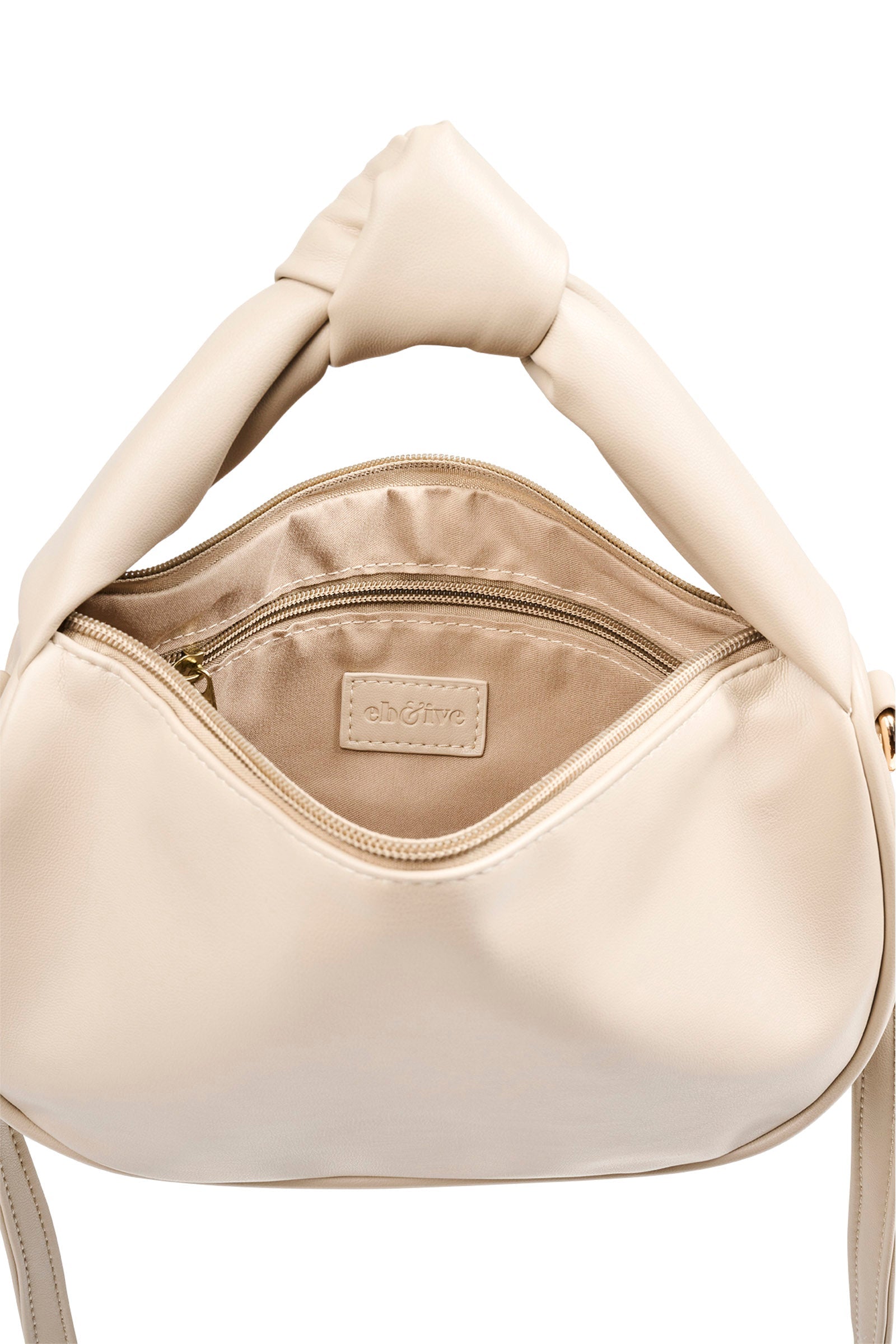 Knot handle detail of the open bisque Zala Bag