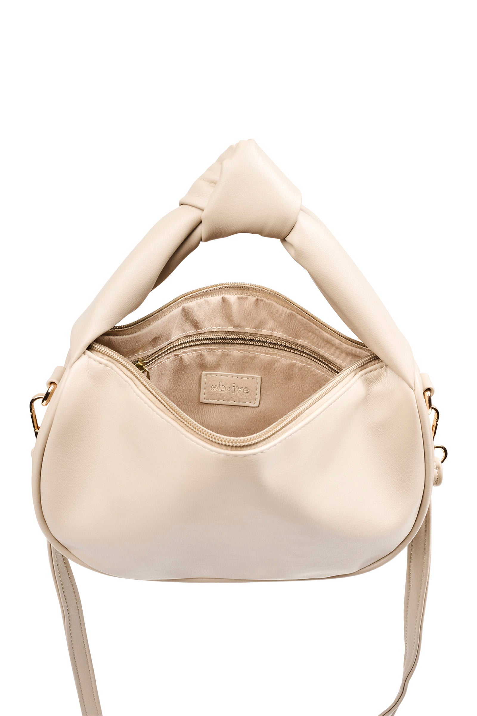 Front view of the bisque Zala Bag with knot handle and strap
