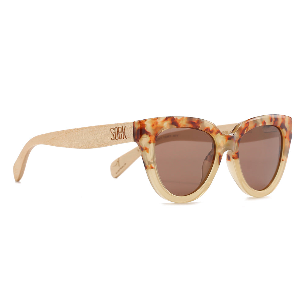 Flutter sunglasses at an angle, showing the pale maple wood arms