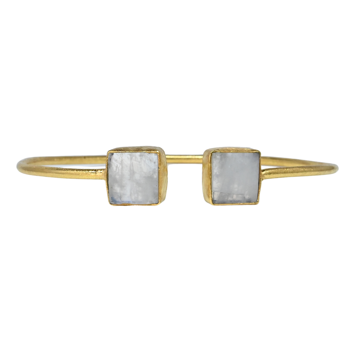 Fine gold cuff bangle with a square milky white moonstone at each end