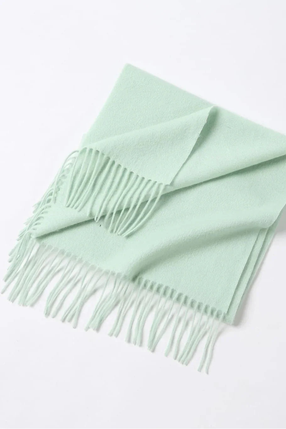 Pistachio scarf folded flat with fringe