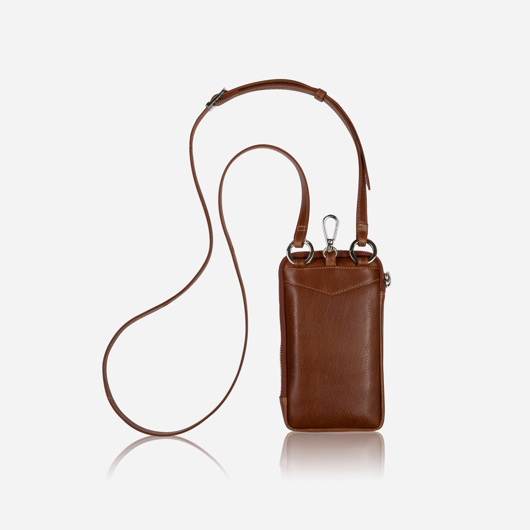 Tan leather phone pouch hanging from its crossbody strap