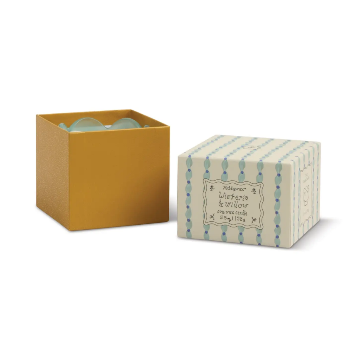 Open gold gift box showing the pale mint tulip candle inside.