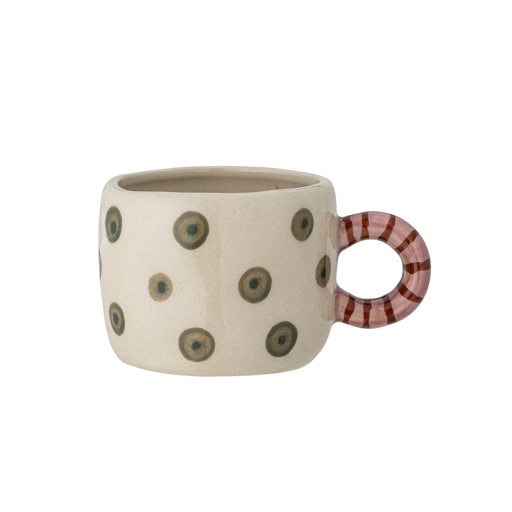 Cream stoneware cup painted with olive green dots, with a round red and pink striped handle