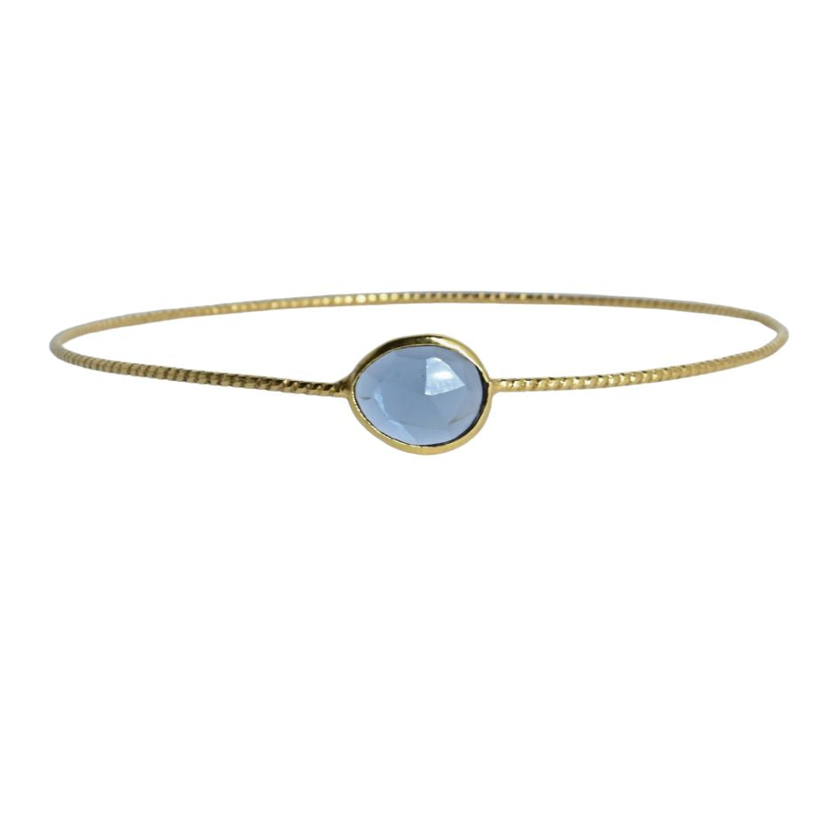 Euro Gold cuff bangle with a faceted soft blue London blue topaz
