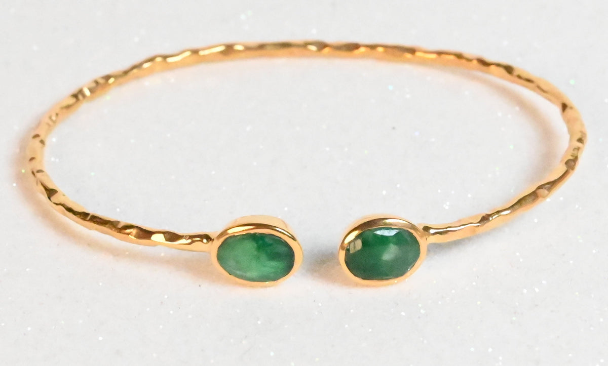 Euro Gold hammered cuff bangle with two emerald-green gems on white
