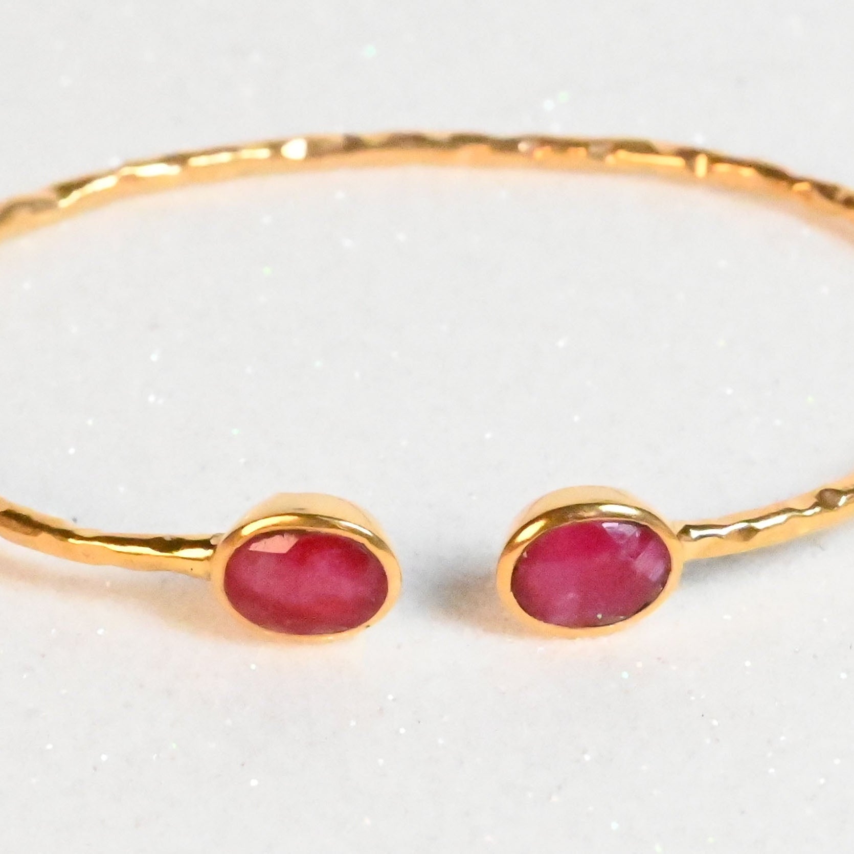Euro Gold hammered cuff bangle with two rich ruby oval gems
