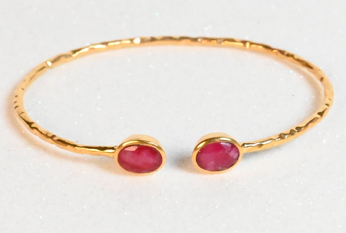 Euro Gold hammered cuff bangle with two rich ruby oval gems