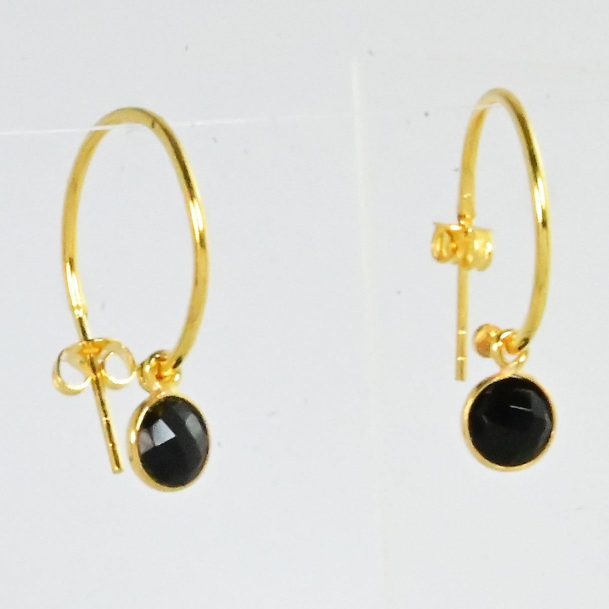 Euro Gold hoop earrings with a faceted black onyx drop