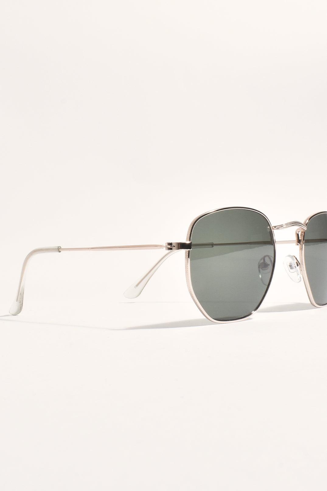 The same sunglasses turned to the side, showing the thin metal arms