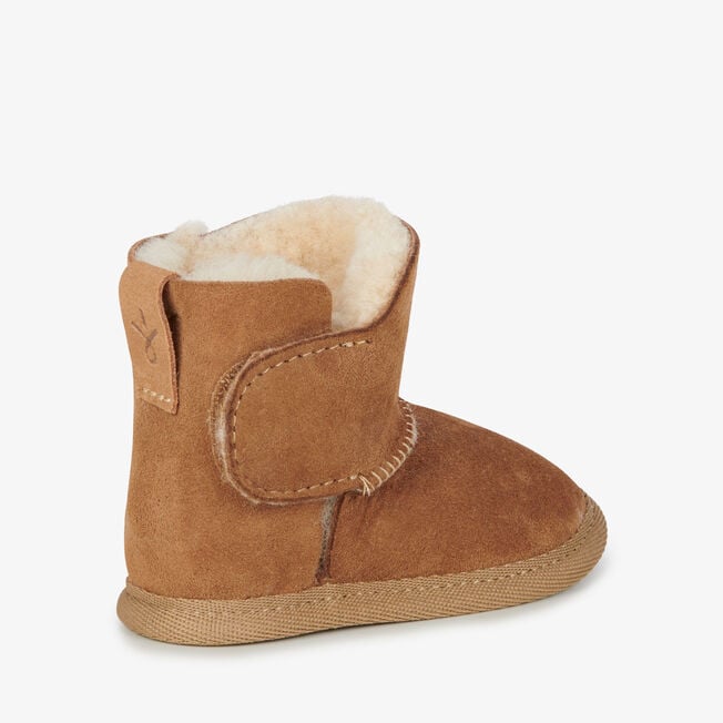Chestnut baby bootie showing thick natural wool collar, inner side view