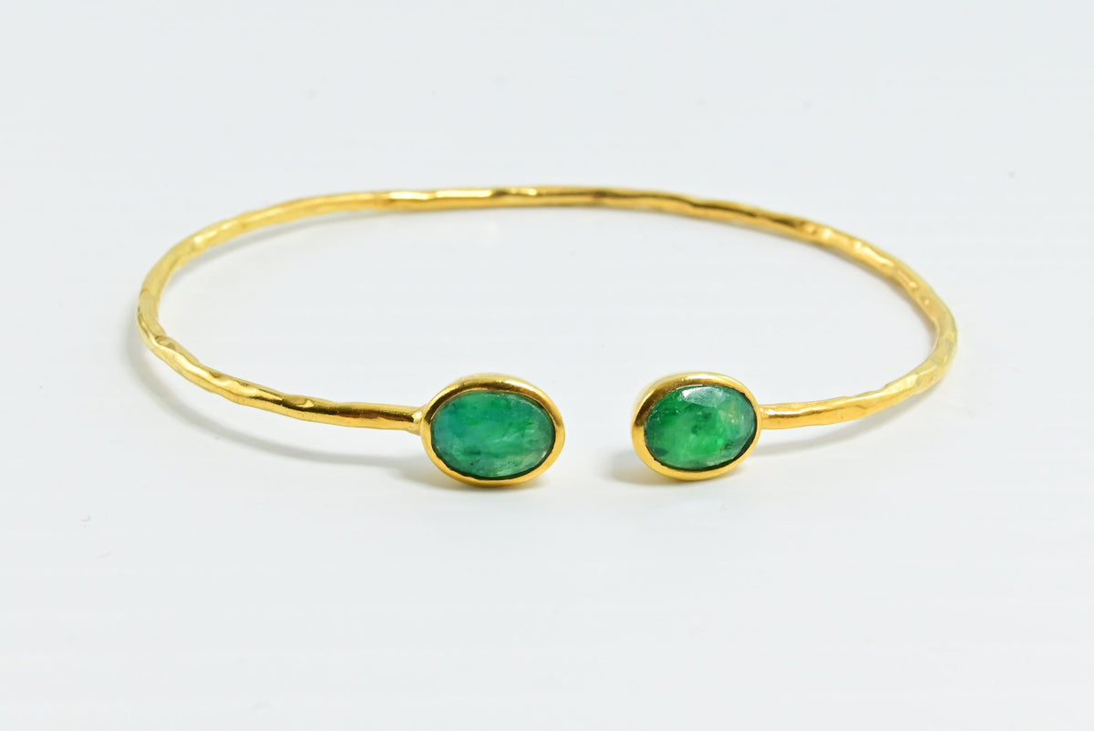 Hammered Euro Gold cuff bangle with two deep green oval gems