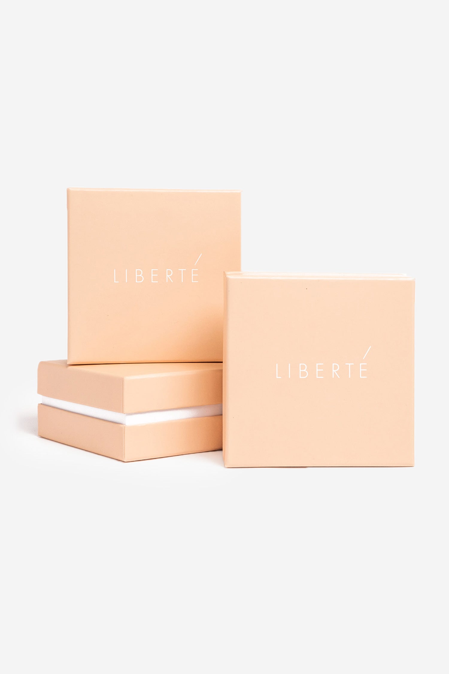 Blush Liberté gift boxes — the signature packaging each piece arrives in.