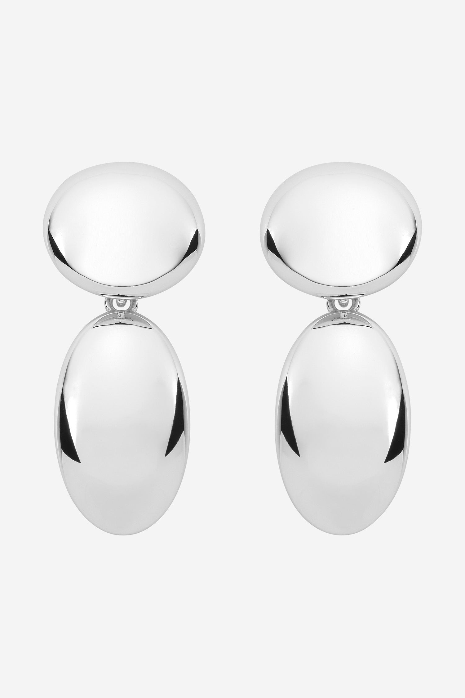 Silver statement drop earrings, two rounded discs with a mirror-like finish.