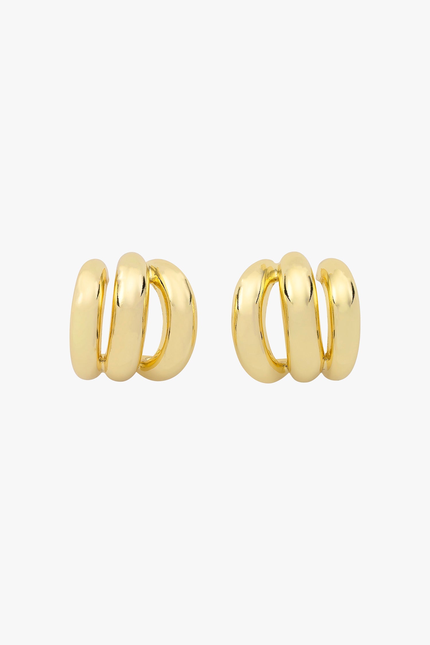 Gold triple-hoop earrings that create a layered look from a single post.