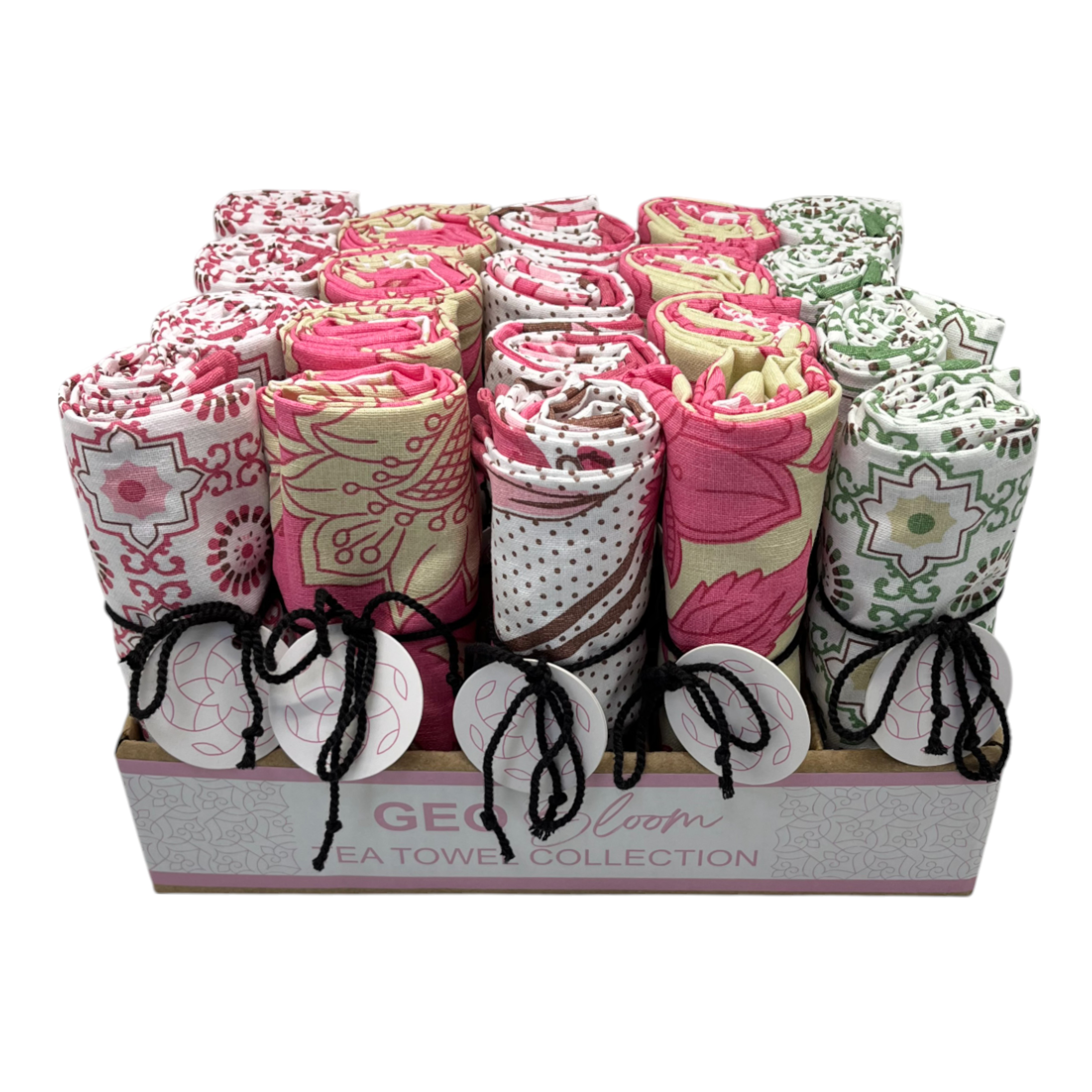Geobloom tea towel counter display box filled with rolled pink, cream and green printed towels