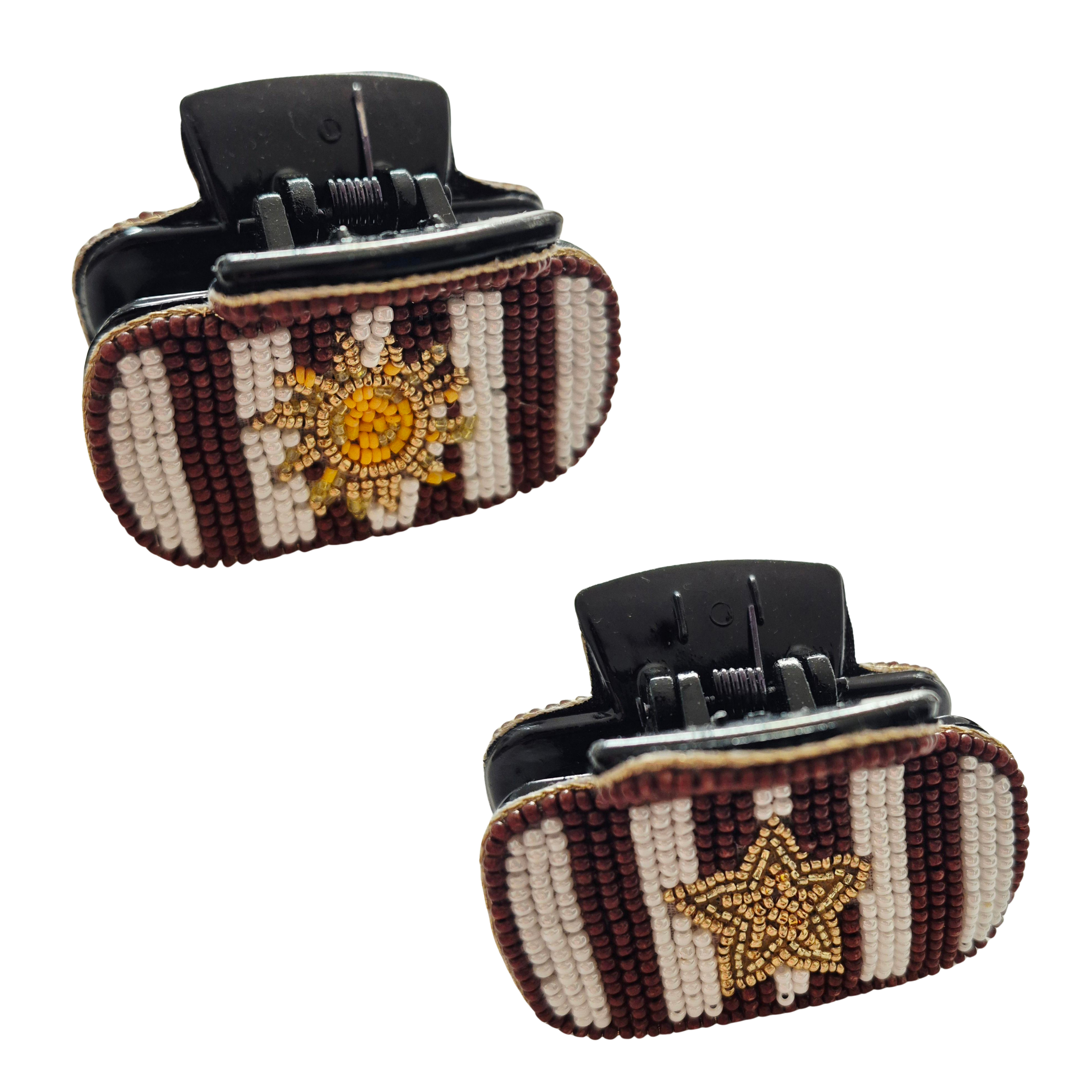 Two black claw hair clips in burgundy and cream striped beadwork, one with a gold sun and one with a gold star.