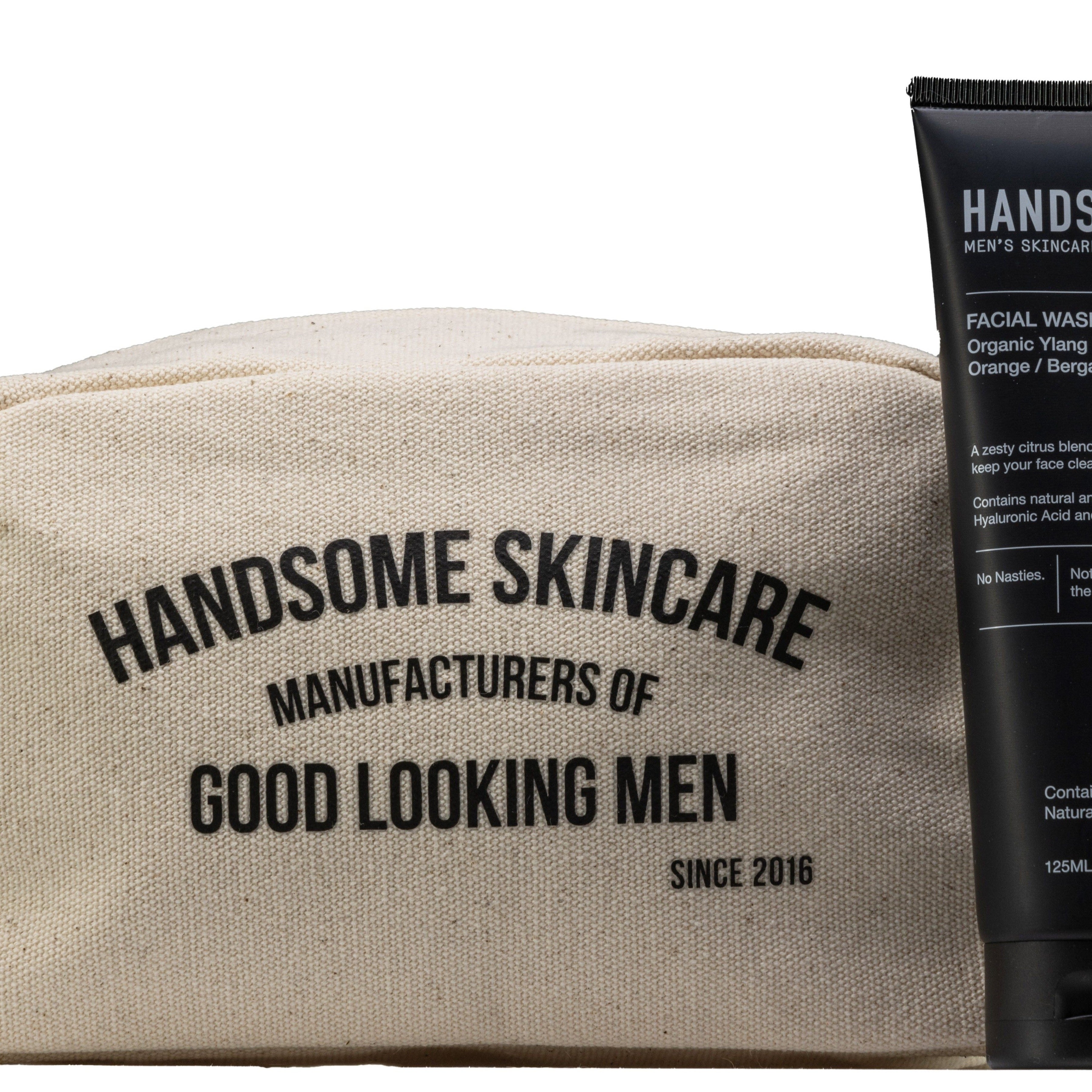 Handsome Essentials Set: printed canvas wash bag beside facial wash and daily moisturiser black tubes