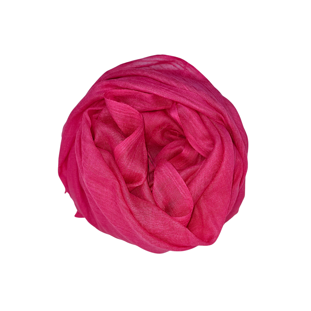 Beauty in Bamboo scarf in Hot Pink, a vivid magenta, swirled into a round coil