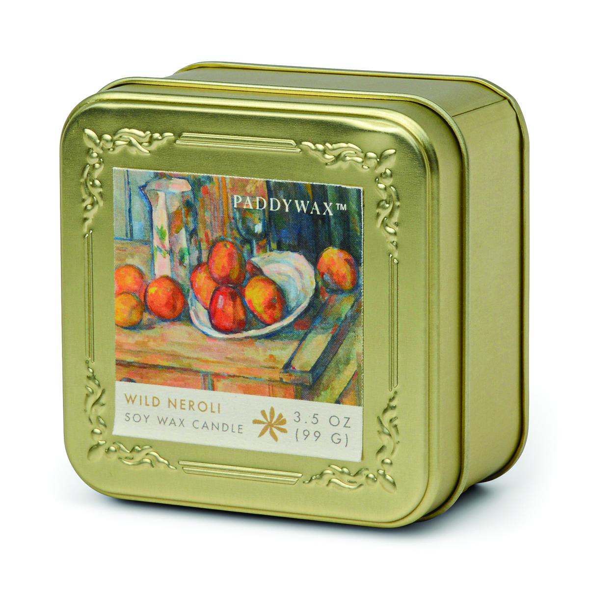 Gold-toned embossed square tin candle printed with Cézanne's Still Life with Milk Jug and Fruit, labelled Wild Neroli soy wax candle, 3.5 oz.
