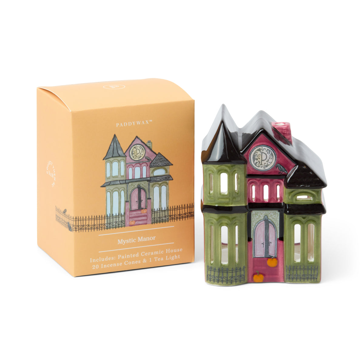 Pink, olive and black painted ceramic Victorian house with cut-out windows and pumpkins on the steps, beside its orange illustrated box.