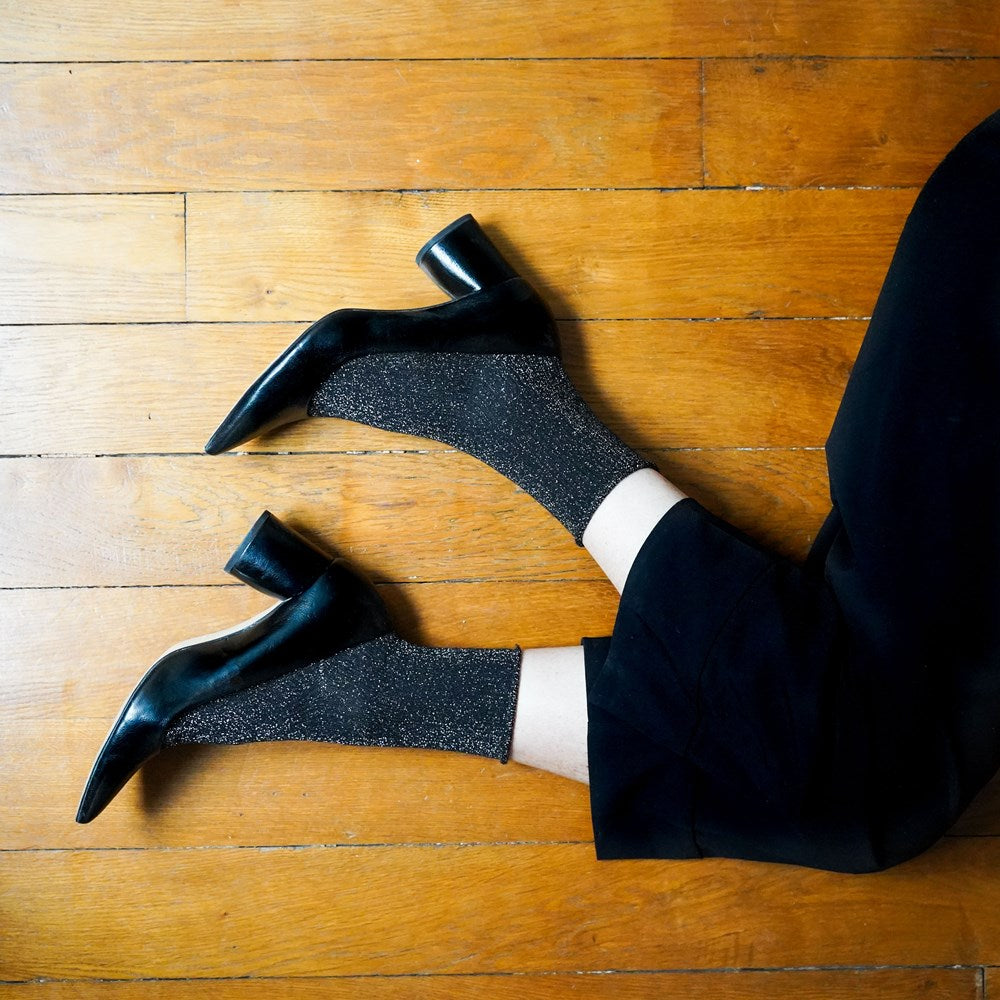 Black sparkle KLUE lurex socks worn with pointed black heels and cropped black trousers