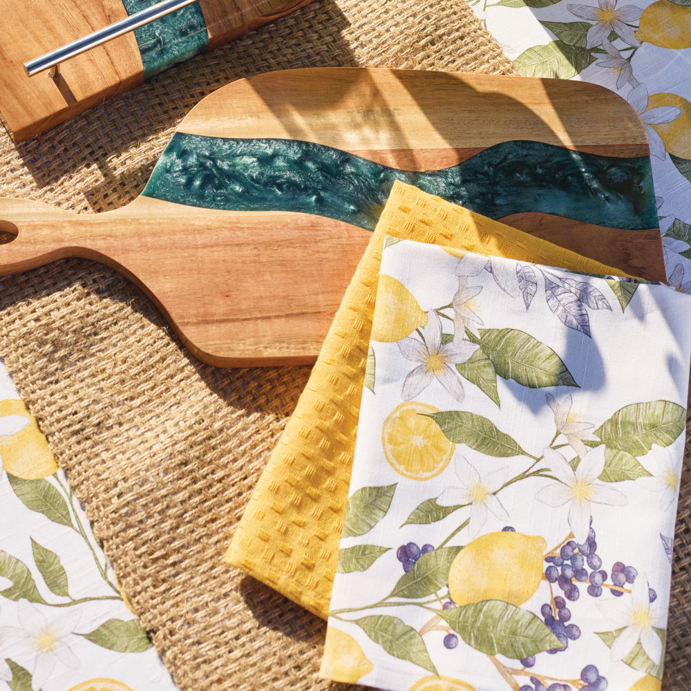 Rowan jute placemat styled with serving boards and lemon-print tea towels
