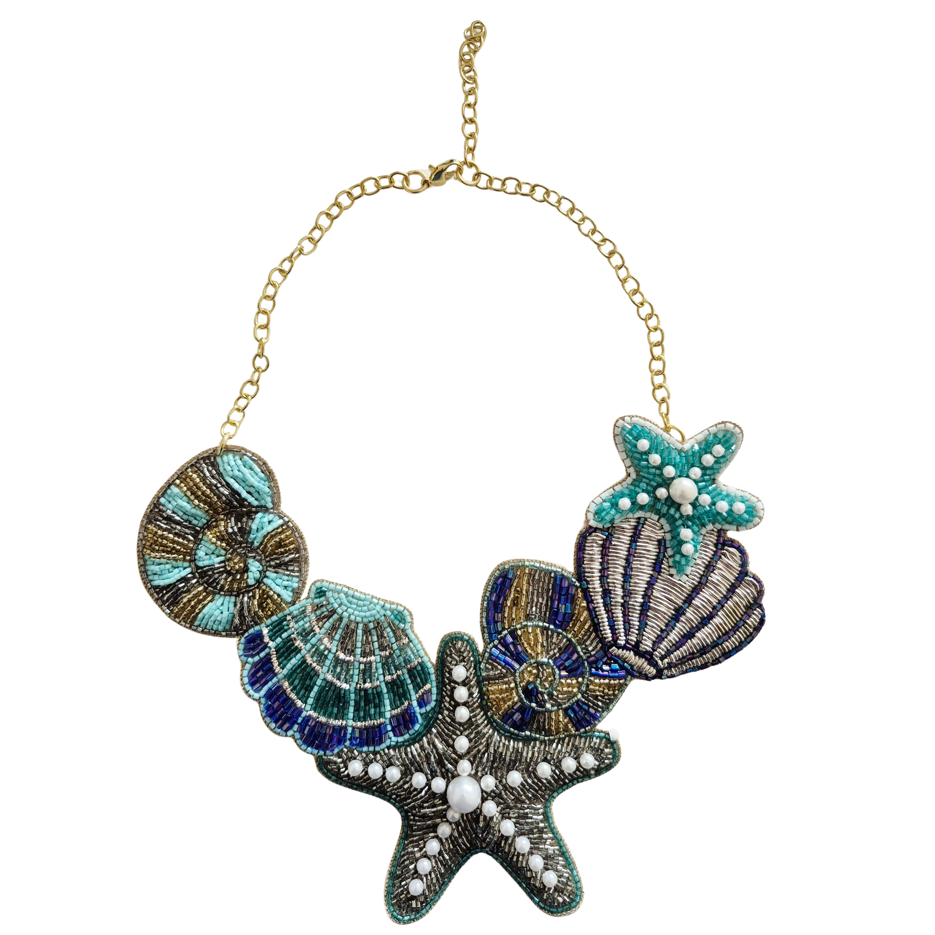 The ocean-themed beaded necklace laid flat, showing shell and starfish motifs on a gold-tone chain.