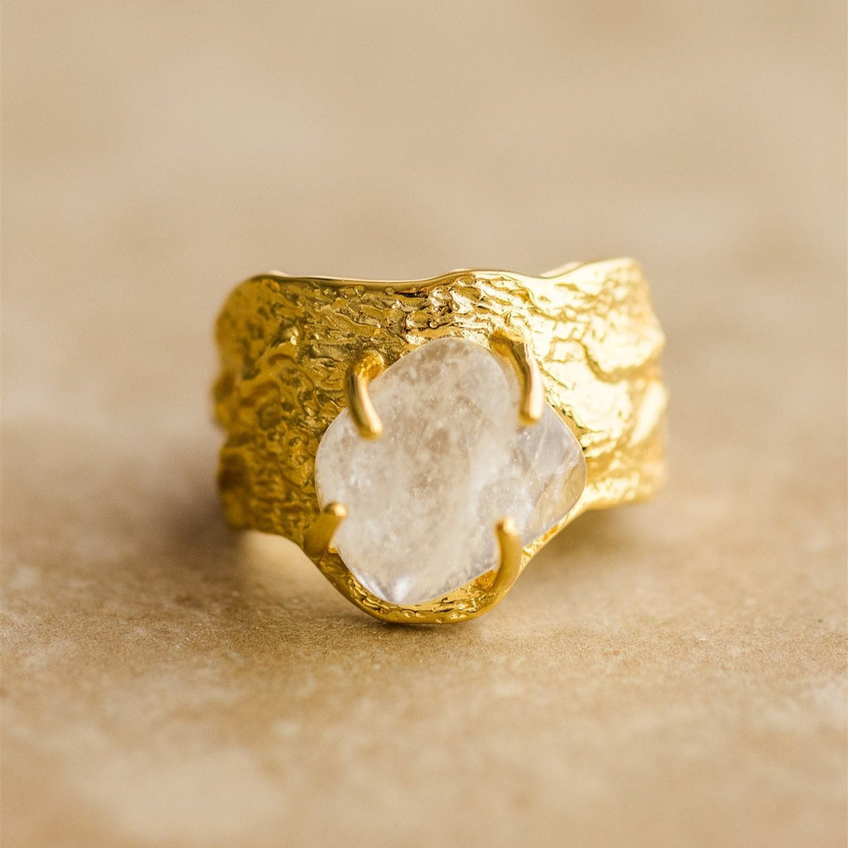 Close view of the Nohea ring showing the claw-set raw clear stone