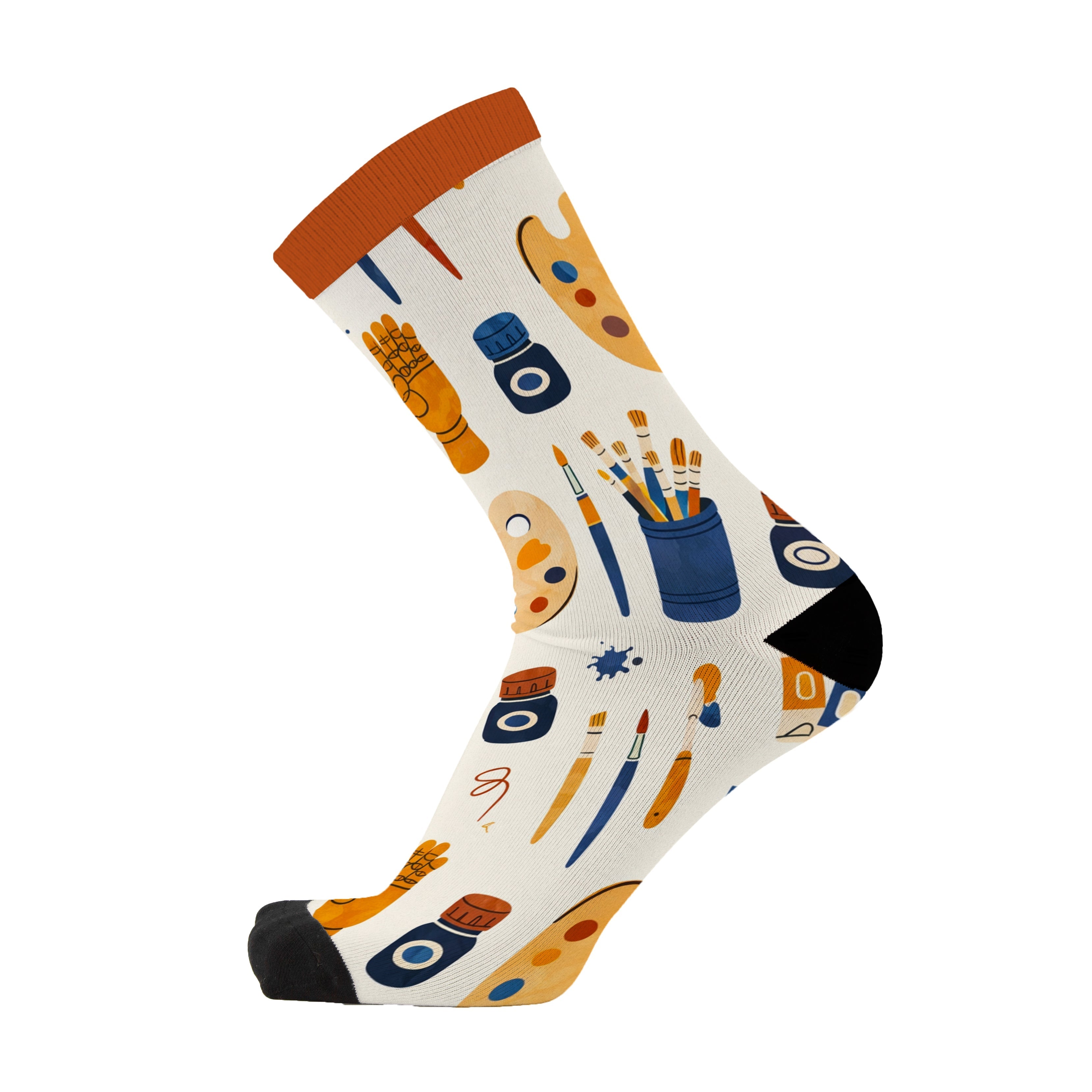 Side view of a single cream sock with an orange cuff and black toe, showing the painting and art supplies print wrapping around the foot.