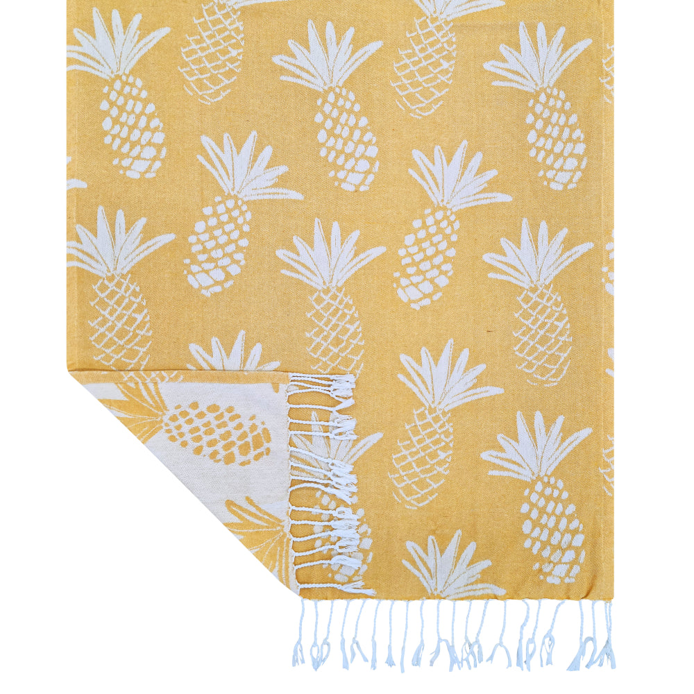 Corner detail of the reversible yellow pineapple weave with knotted fringe
