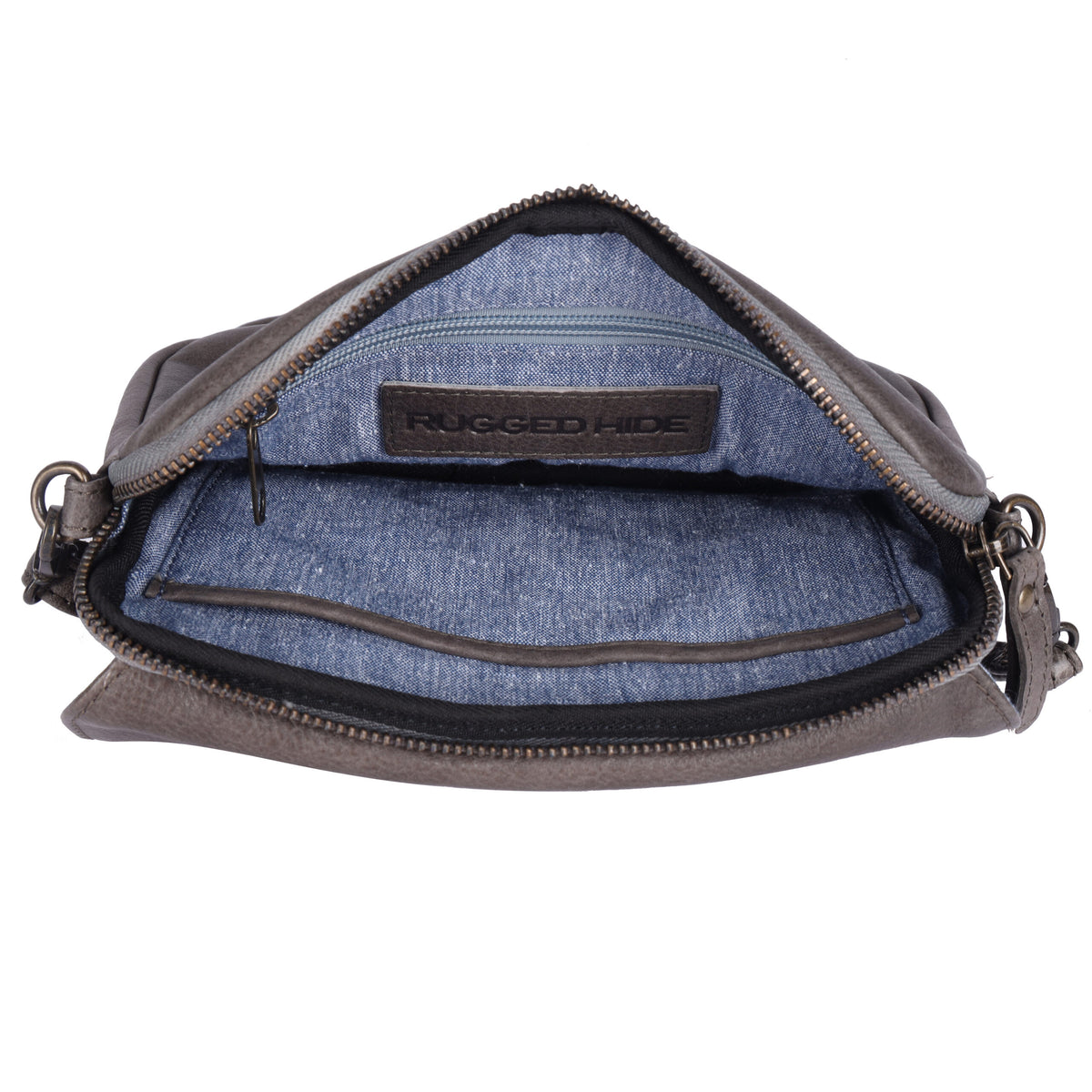 The taupe bag unzipped from above, showing the blue lining and a stamped leather tab