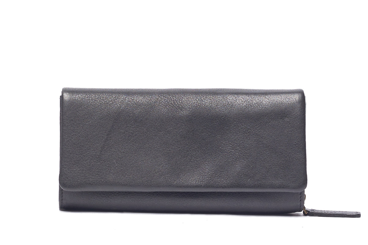Black leather wallet closed, a long fold-over flap with the zip pull at the side