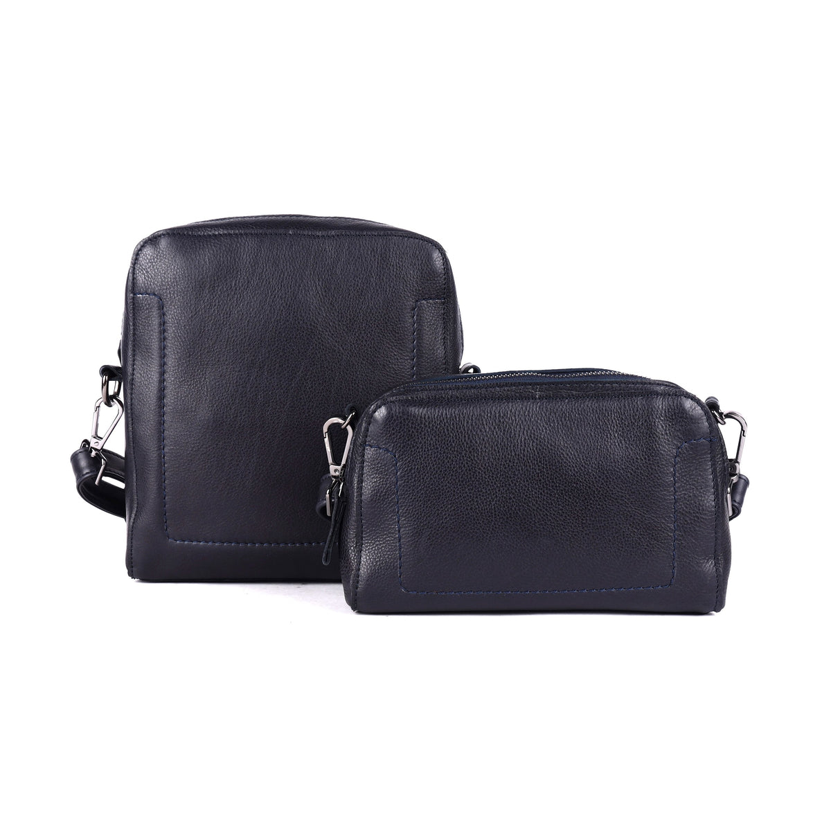 Navy sling bag beside a smaller navy zip bag from the same range