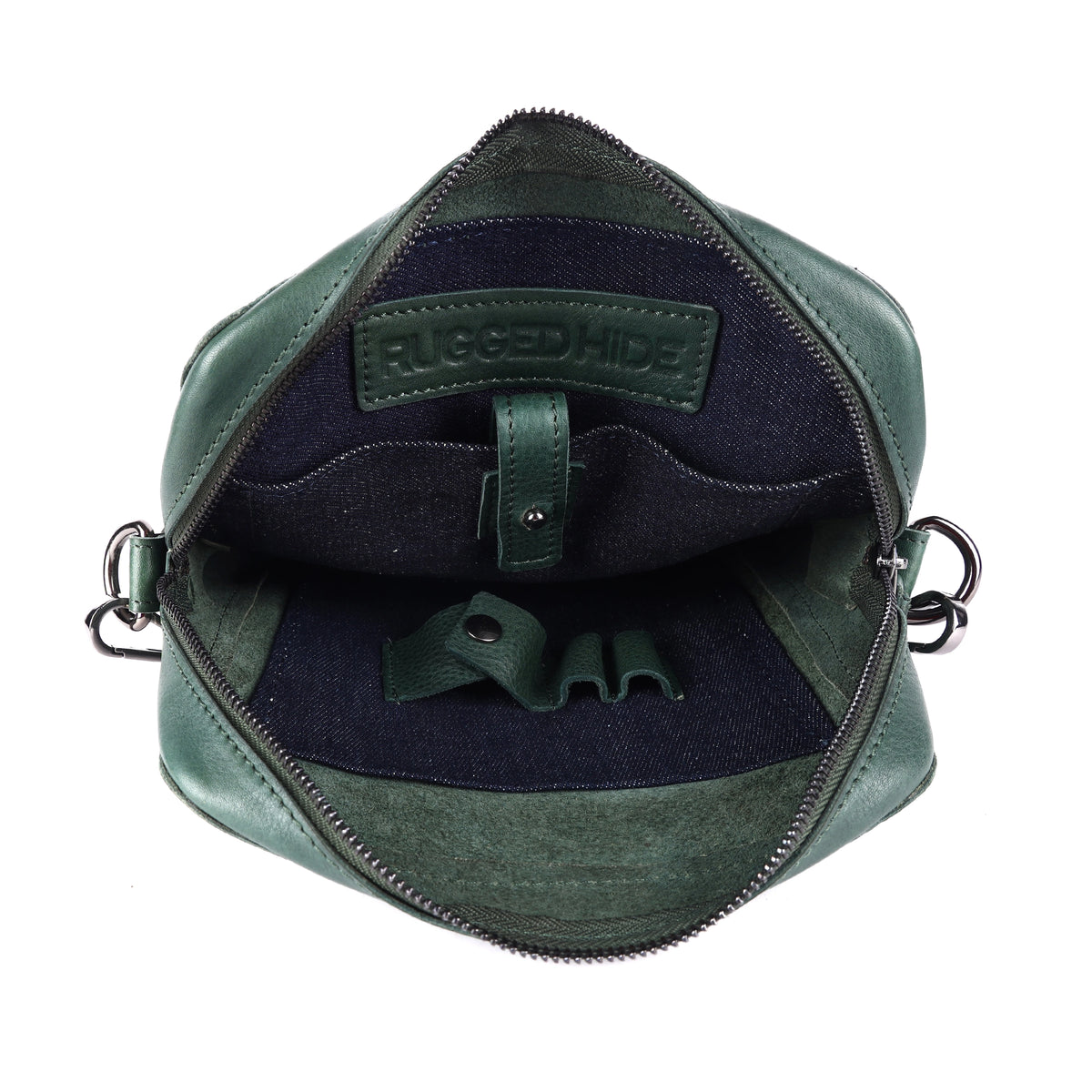 The green bag open, showing the dark navy lining and the tablet sleeve tab