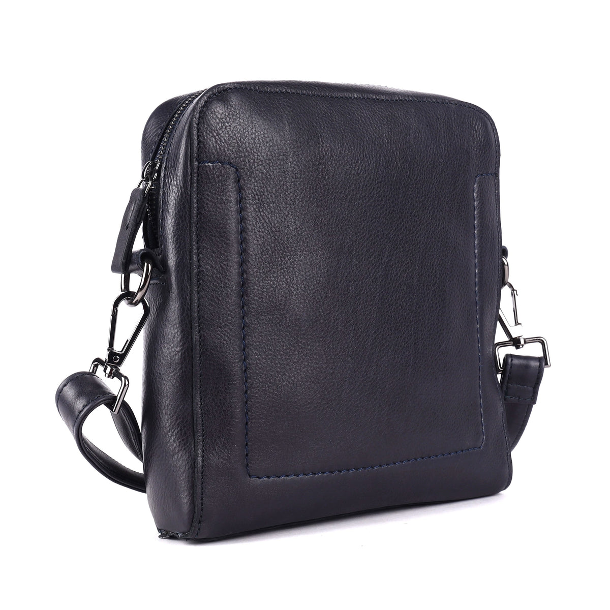 Navy leather sling bag angled, an upright squared body with a clip-on strap