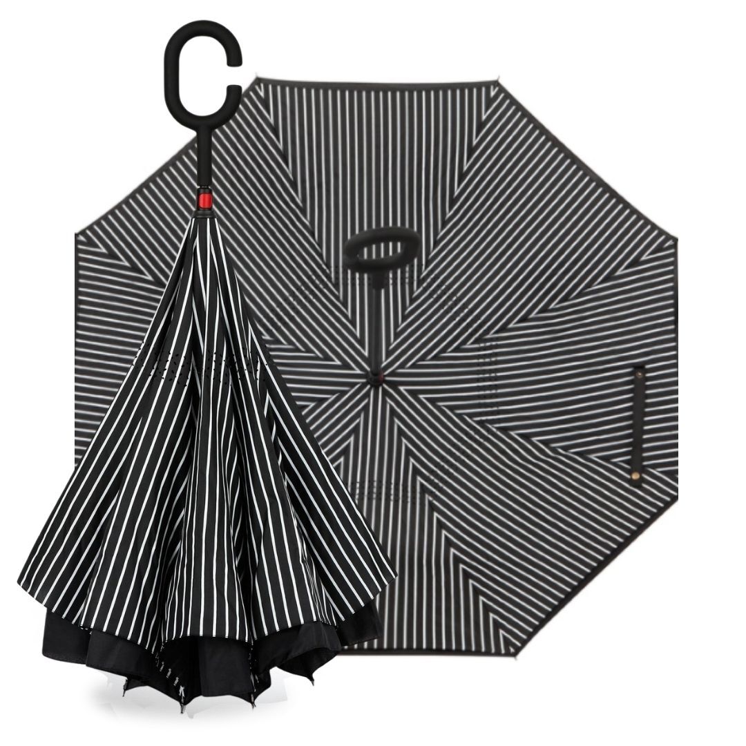 Reverse umbrella in Black & White Pinstripe, shown open and folded inward with its C-hook handle