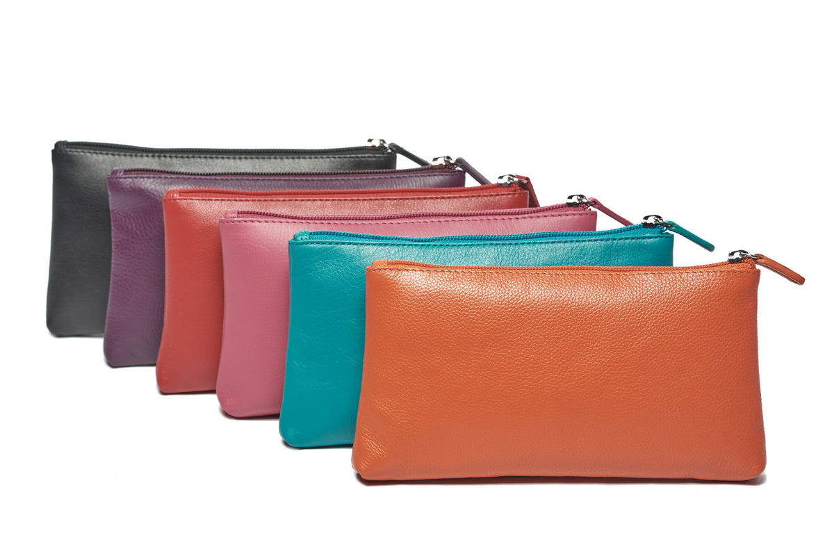 Makeup cases fanned out in black, purple, red, pink, aqua and orange