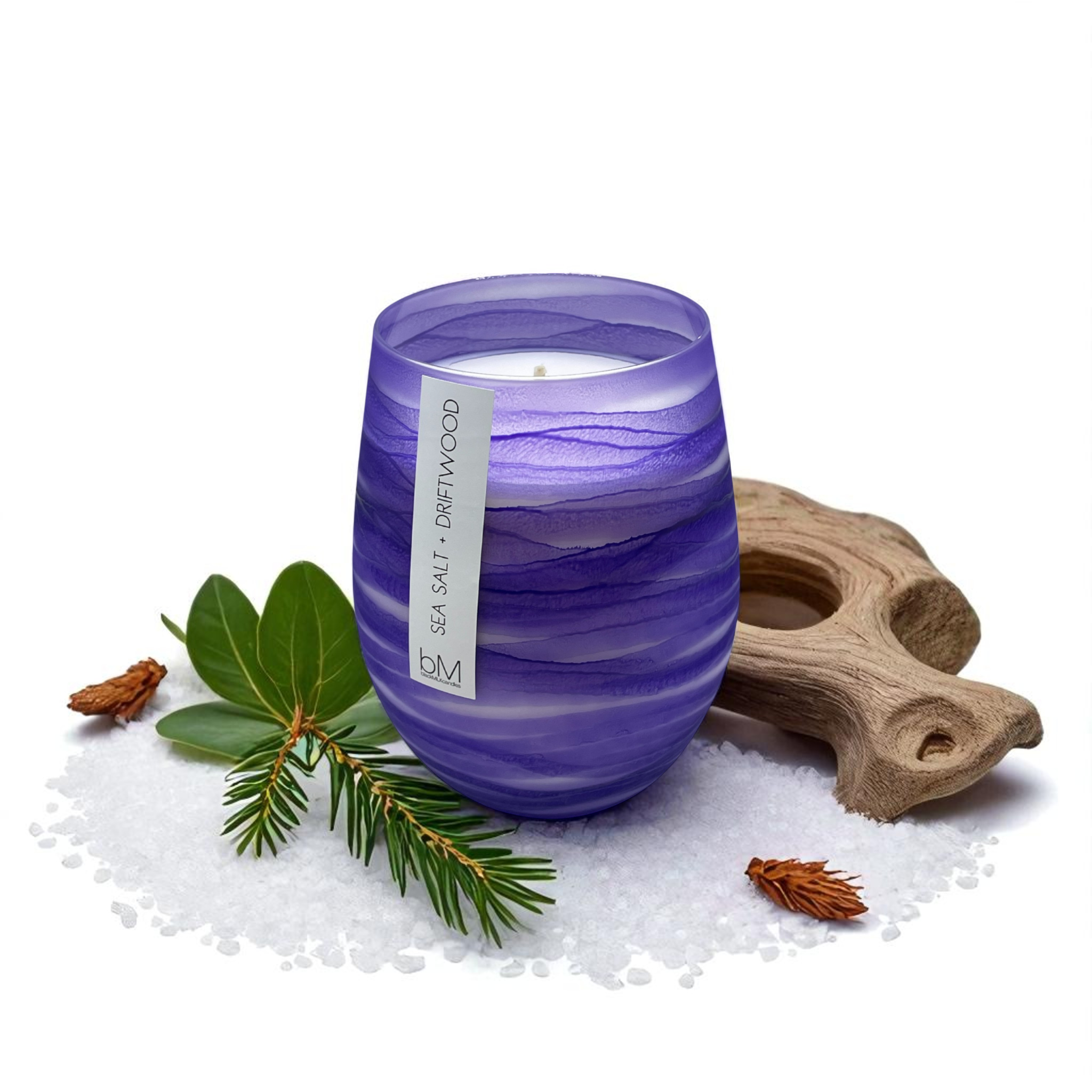 Wave Purple Sea Salt and Driftwood candle with sea salt crystals, weathered driftwood, pine and green leaves — the fragrance notes
