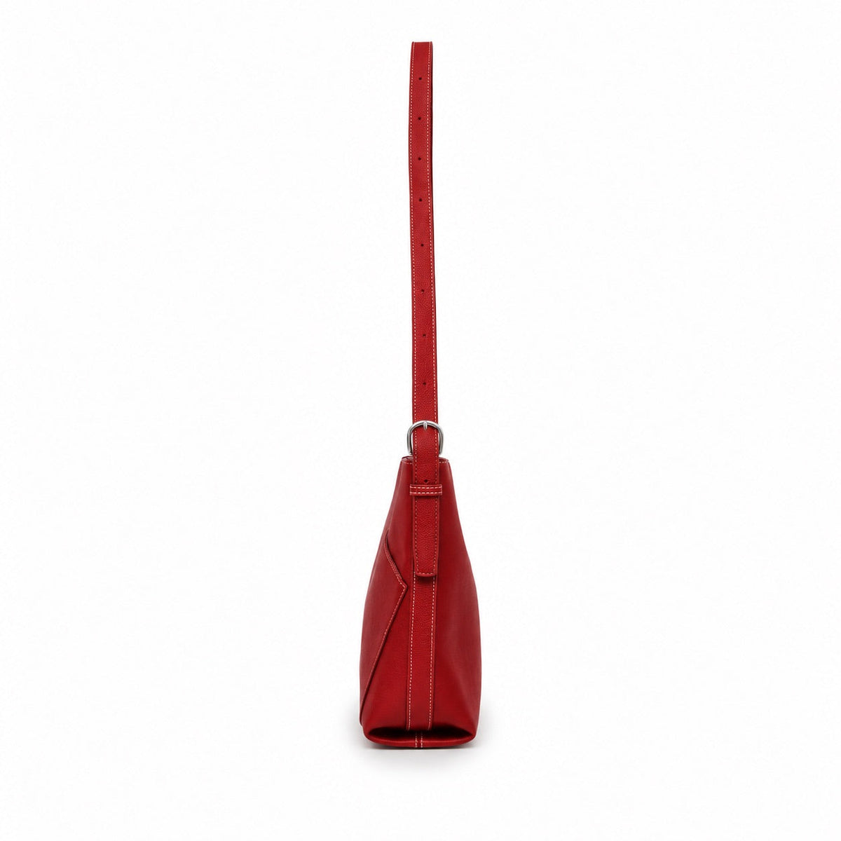 Side view of the red bag, showing its depth and the strap buckle.