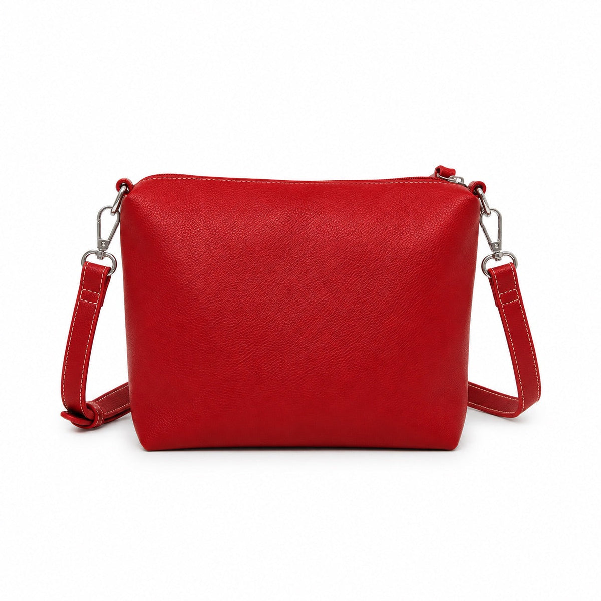 The red mini cross body bag on its own, with a zip top and a clip-on strap.