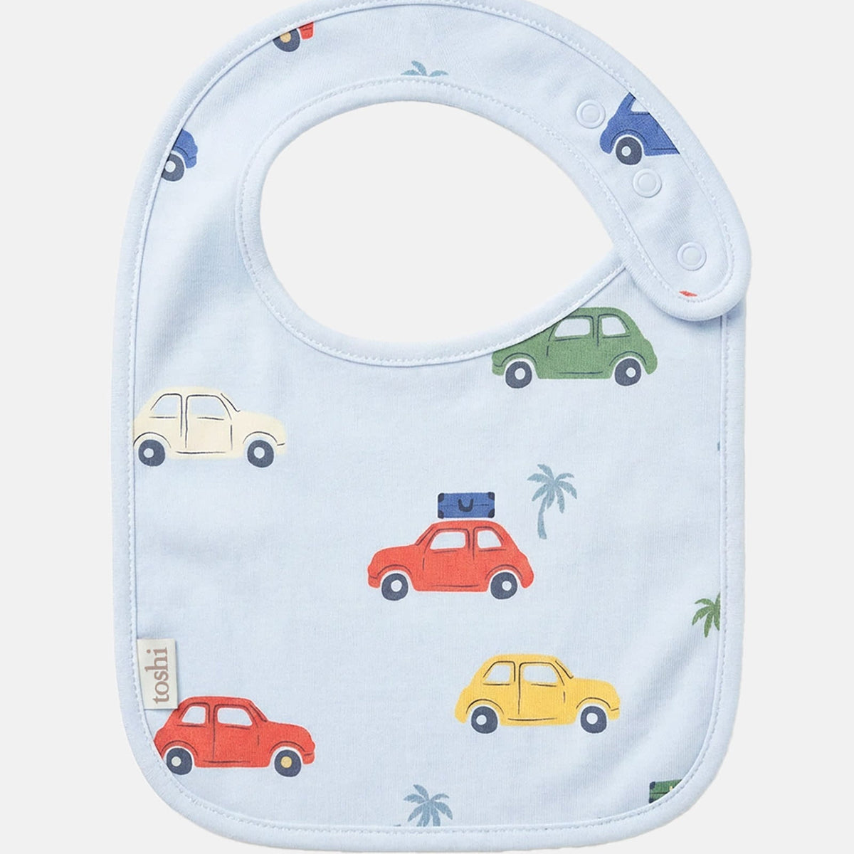 Toshi Arcadia Big Mini baby bib in pale blue cotton printed with colourful vintage cars and palm trees