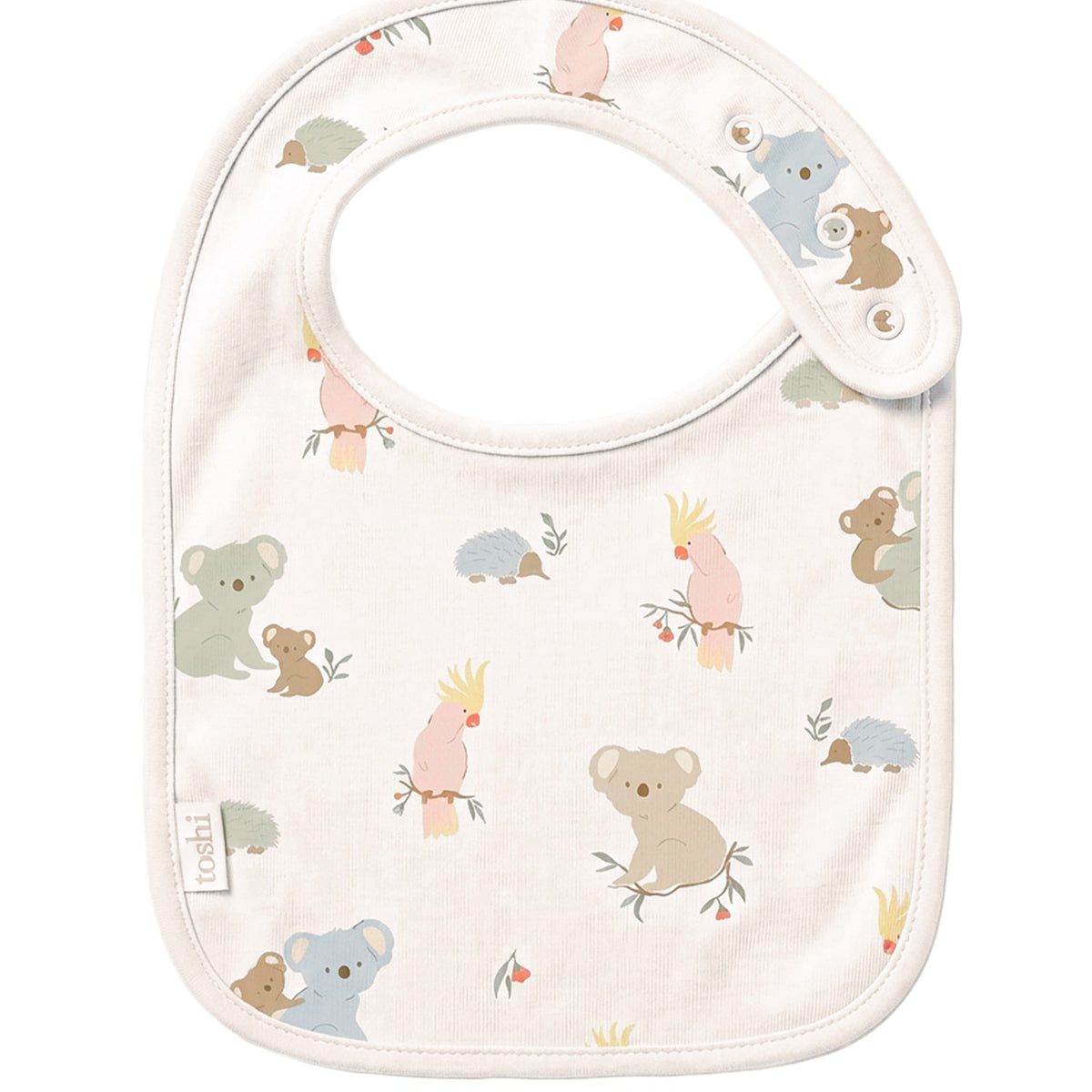 Toshi Arcadia Gumnut Babies baby bib in cream cotton printed with koalas, cockatoos and echidnas